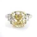 Natural Yellow Diamond 5.04 carats set in Platinum and 18K Yellow Gold Ring with 0.64 carats side Diamonds / EGL Report