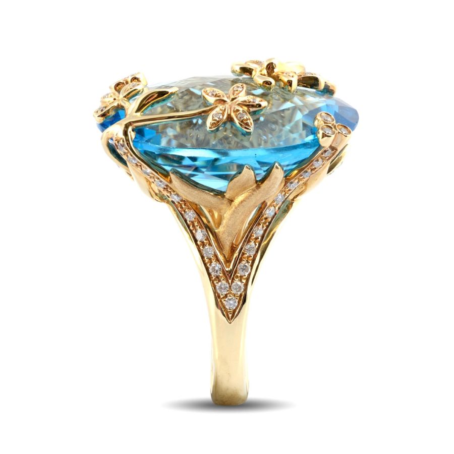 Natural Swiss Blue Topaz 28.57 carats set in 18K Yellow Gold Ring with 0.41 carats Diamonds