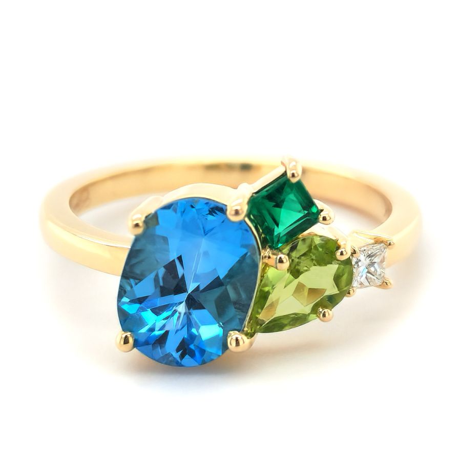 Natural Blue Topaz, Peridot, Emerald, and Diamond 2.07 carats total weight set in 14K Yellow Gold Ring